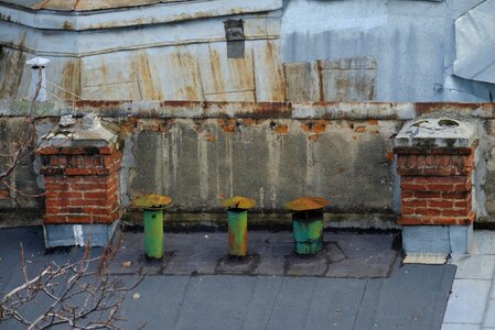 Old Chimneys on a Building Rooftop photo