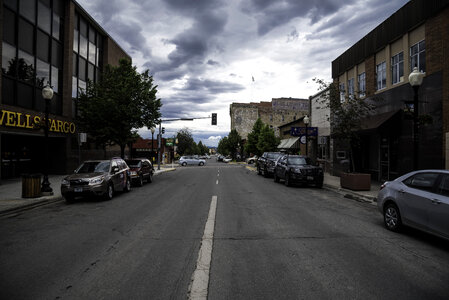 Buildings, cars, buildings, and sky on a stormy day in Helena