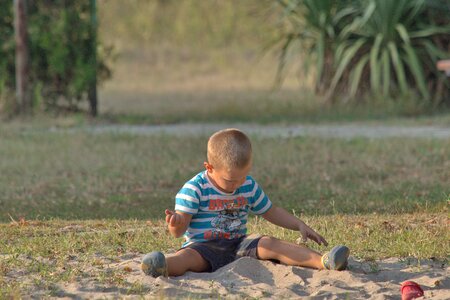 Boy playground sand photo