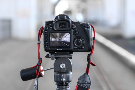 Rear DSLR Camera on Tripod with Blurred Background photo