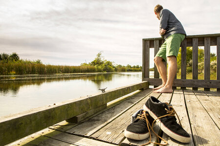 Refuge visitor relaxes on the dock photo