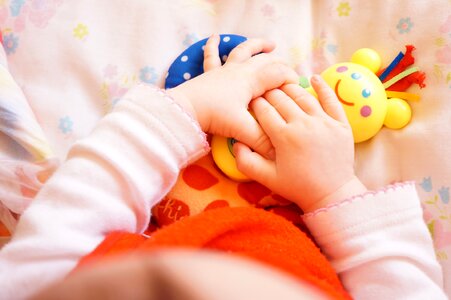 Hand infant plays