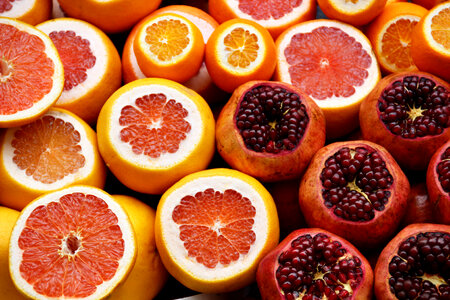 Citrus Fruits Half Cut Orange, Grapefruit, Pomegranate photo