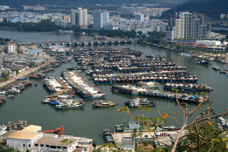 Boats and buildings with cityscape in Sanya