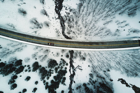 Aerial Shot of Snow Covered Road Curve photo