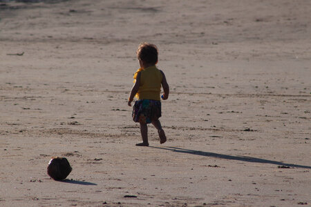 Child Walking Beach Sands photo