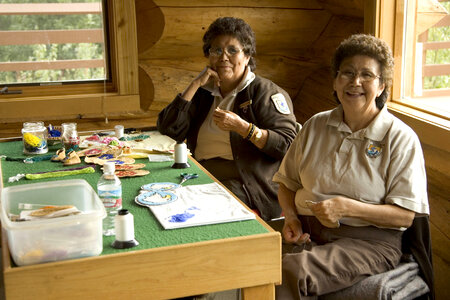 Native American U.S. Fish and Wildlife Service employees making crafts