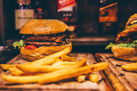 Hamburger and French Fries on Wood photo
