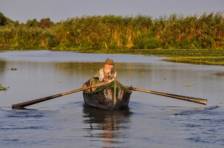 Oarsman rowboat man photo