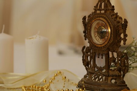 Analog Clock bronze candles photo