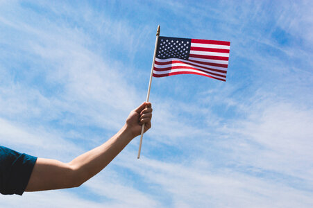 Hand Holding USA Flag photo