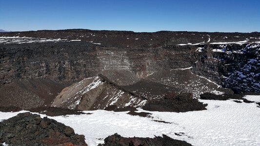 Slope of Mauna Kea; ranger station visible among the craters photo