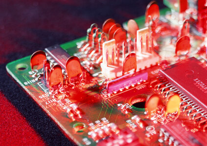 Detail of an electronic printed circuit board with many electrica photo