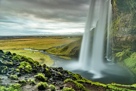 Smooth Waterfall among the landscape photo