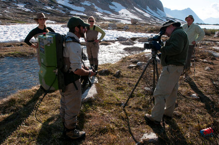 Videographer interviews biologist photo