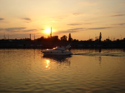 Sunset boat ocean photo