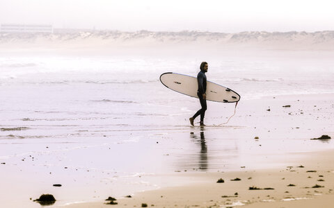 Surfer on the Ocean Beach photo