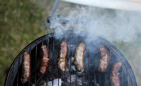 Grilling Sausages on Barbecue Grill Outdoors photo