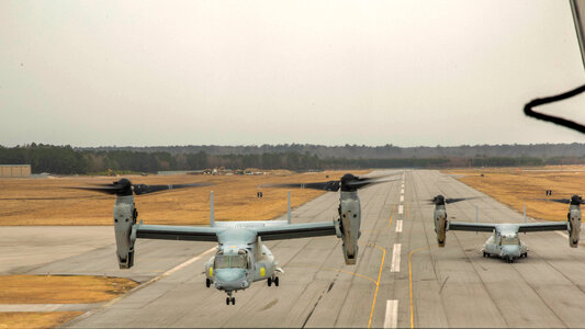 Two MV-22B Ospreys with Marine Medium Tiltrotor take off photo