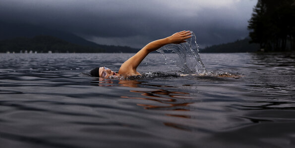 Man Swimming the Front Crawl in a Lake photo