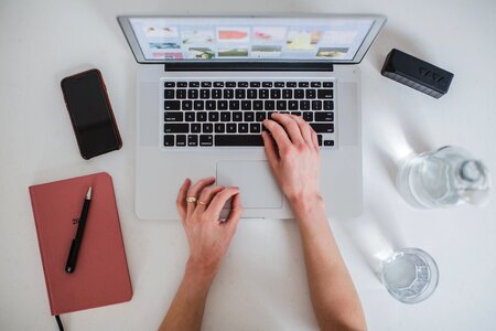 Woman's Hands Typing on Laptop photo