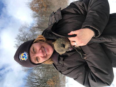 Biologist with baby black bear