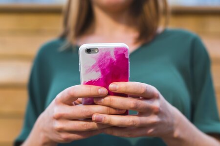 Woman Using Pink Smart Phone photo