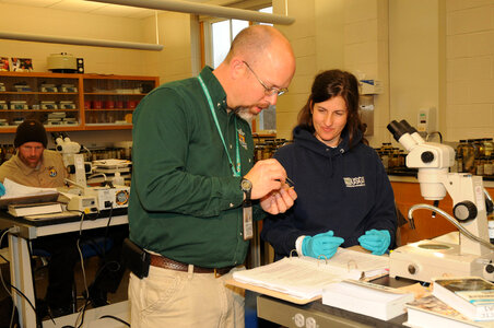 NCTC Fish ID instructor helps a student-3