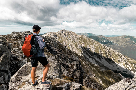 Active hiker enjoying the view. Summer mountain view. photo