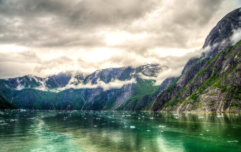 Landscape of mountains and Fjords under clouds around Juneau, Alaska photo