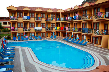Small holiday hotel with pool early in the morning in Turkey photo
