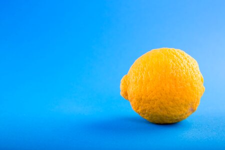 Lemon on Blue Background photo