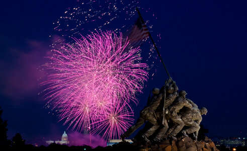 Fireworks are seen from the U.S. Marine Corps Memorial area, in Arlington, Va. photo