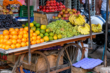 Street Vendor Selling Fruits on His Fruit Cart photo