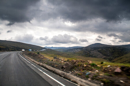 Road and landscape under clouds in the Andes photo