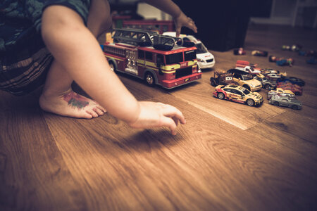 Boy Playing with His Cars photo