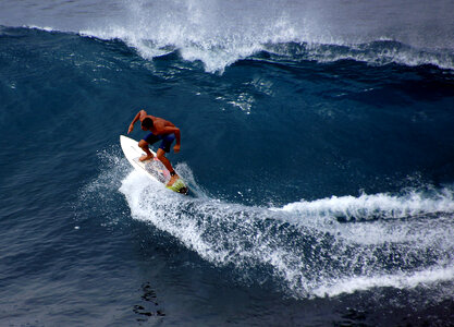 Surfer riding the wave on the ocean photo