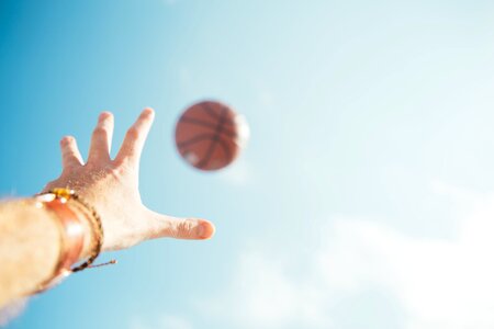Basketball and Hand in Sky photo