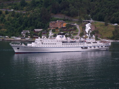 luxurious passenger ferry in a Norwegian Geiranger fjord photo