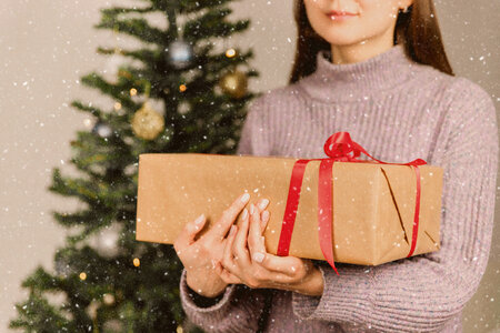 1 Young girl holds Christmas presents. Merry Christmas photo