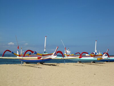 Sand boats ocean photo