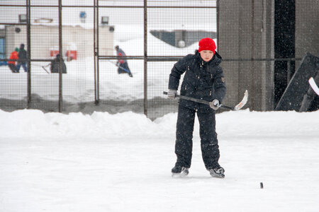 boy playing ice hockey photo