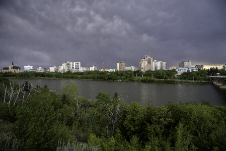 Full Skyline of Saskatoon under the clouds and skies photo