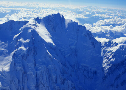 Severe mountains peaks covered by snow