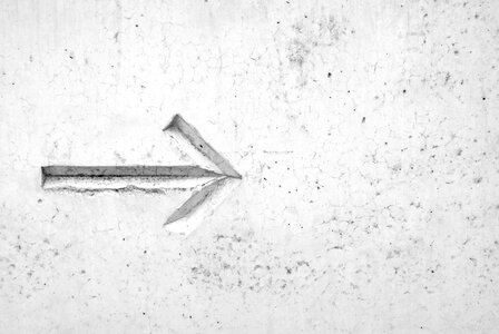 This Way - Arrow on Concrete Wall photo