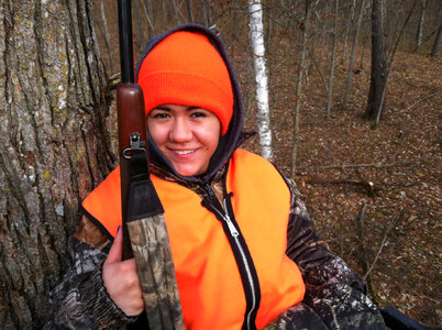 Youth deer hunter in treestand-2 photo