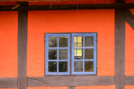 Orange Building With Blue Windows photo