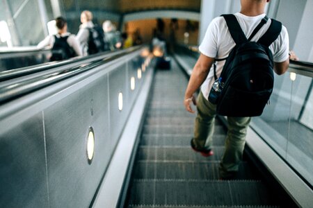 Crowd escalator luggage photo