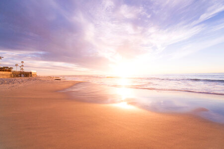 Sunrise - Empty Beach, Violet Sky Reflecting in Wet Sand photo