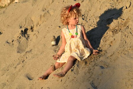 Pretty Girl playful sand photo